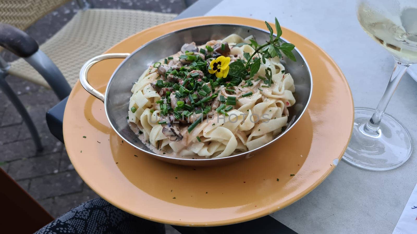 Tagliatelle pasta with mushrooms in a creamy sauce with parmesan and white wine, horizontal