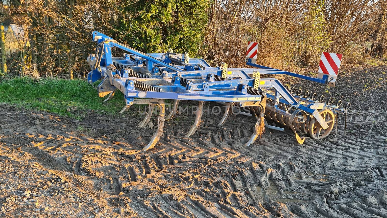 Use harrow with multiple metal teeth to pulverize the soil