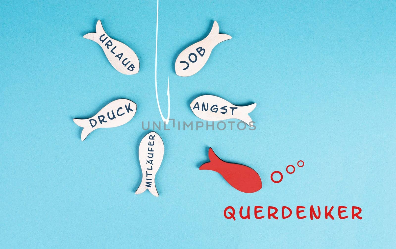 Group of fishes with words like fear, pressure, follower swimming to the fishing rod, red fish makes his own decision, takes a different direction, against the stream, german language