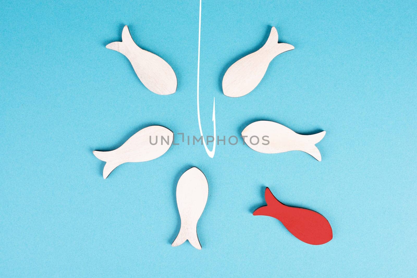 Group of fishes swimming to the fishing rod, red fish thinks different and takes the opposite direction, against the stream symbolic, courage and winner concept