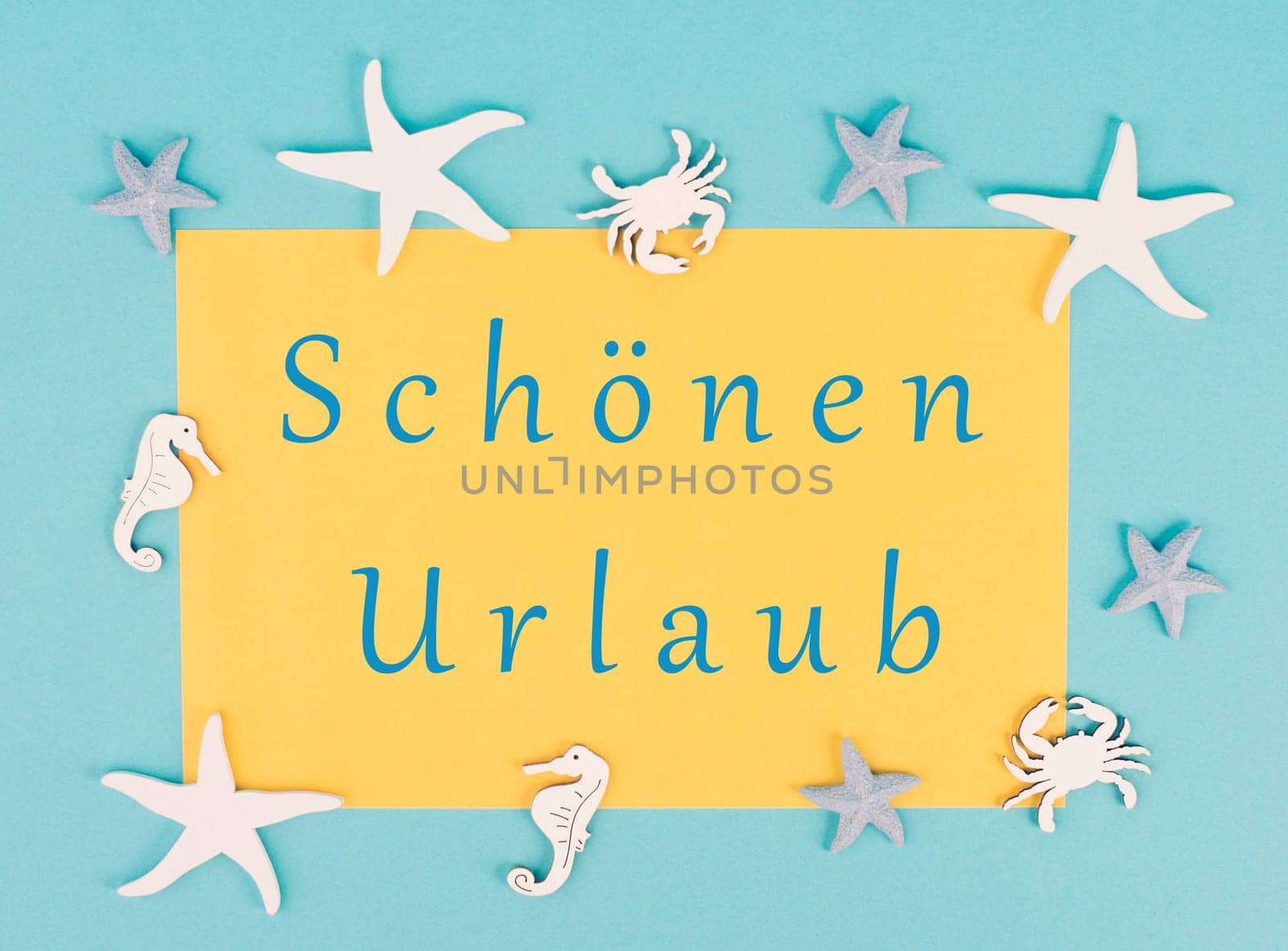Yellow colored paper with the words nice vacation in german language, sea stars, seahorses and crab bulding a frame, summer holiday, tourism travel destination