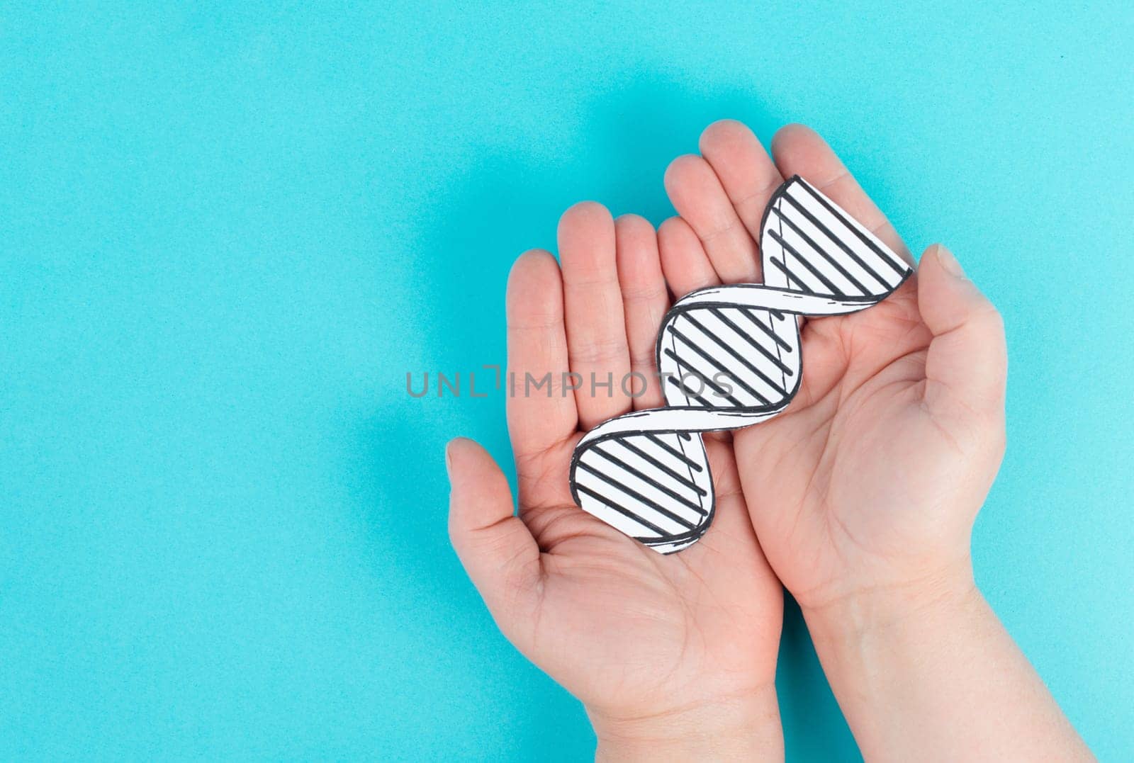 Holding a DNA strand in the hand, genetic therapy and treatment, biotechnology in mordern medicine, gene-based vaccination health care