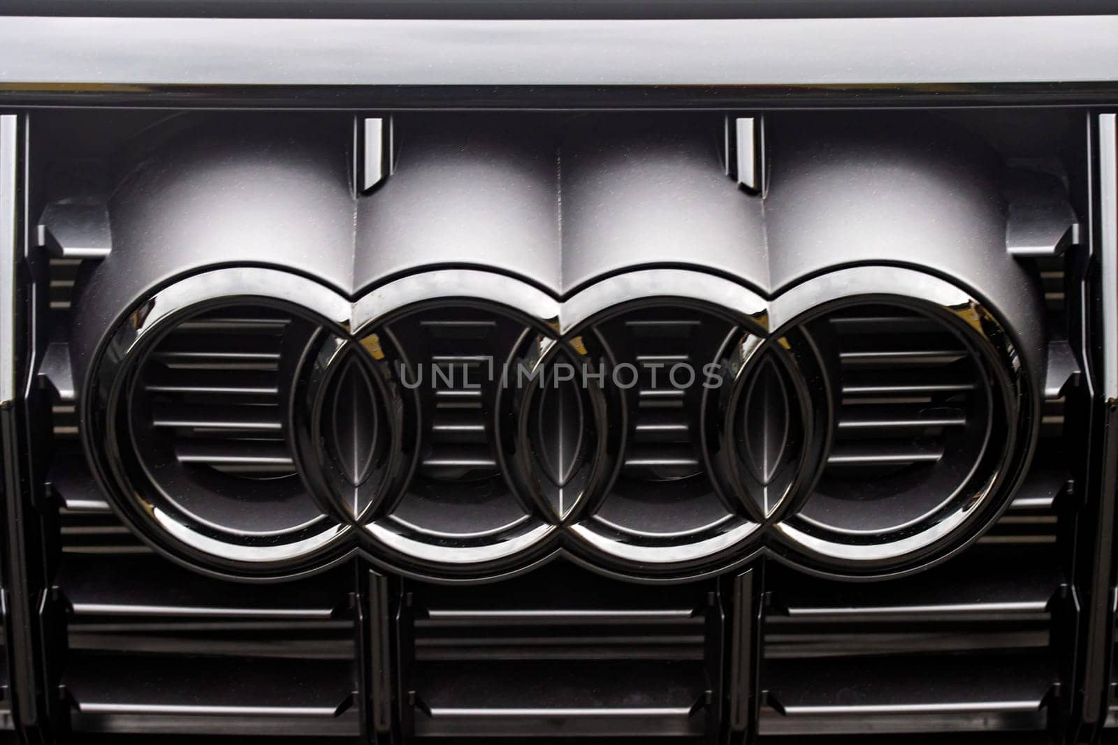 WETZLAR, GERMANY 2022-04-23: Close-up of Audi logo on a Car. Audi AG is a German automobile manufacturer that designs, engineers, produces, markets and distributes luxury vehicles.
