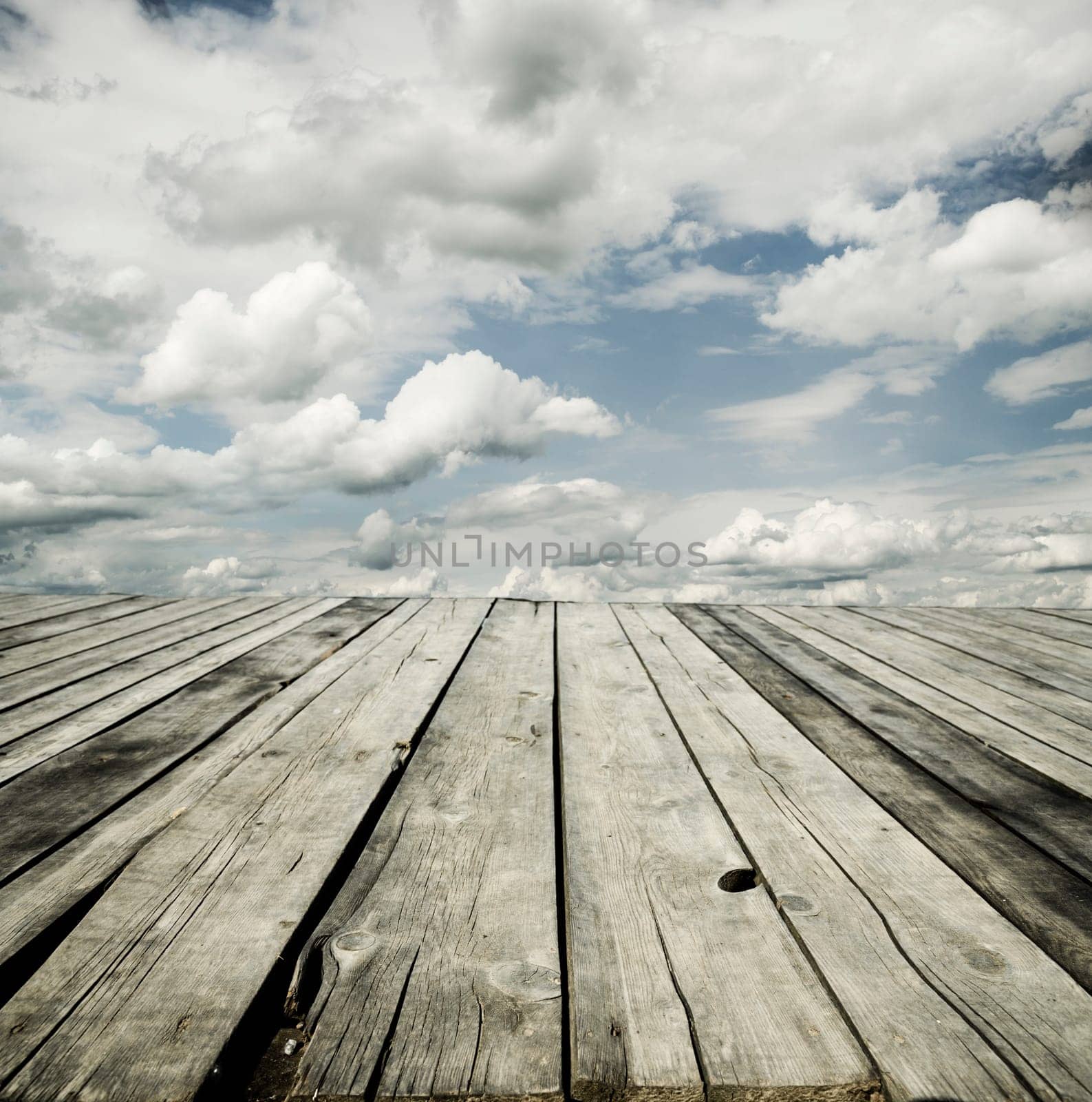 Rustic wooden planks and cloudy sky background design.