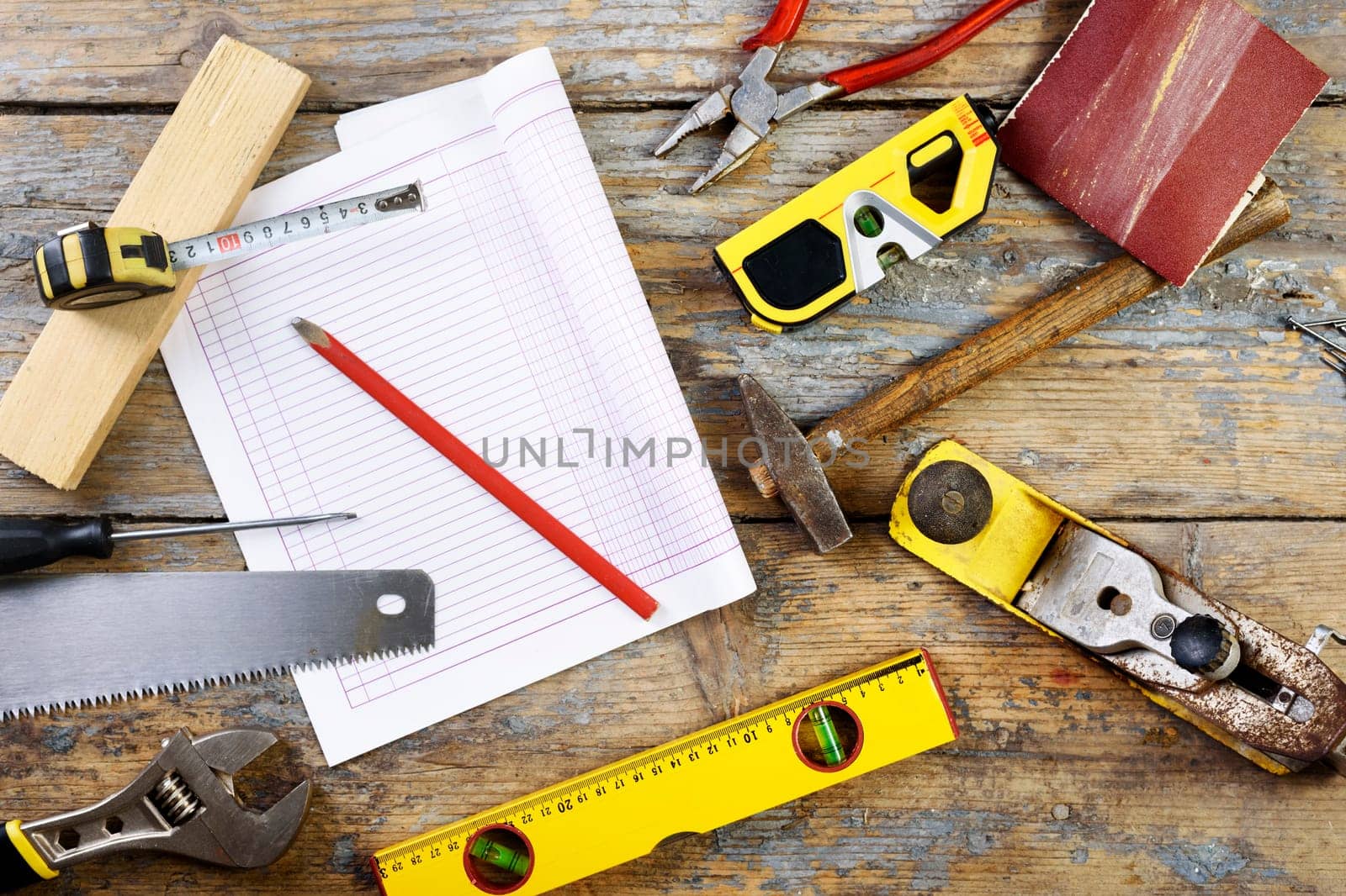 Various carpenter's tools on wooden table