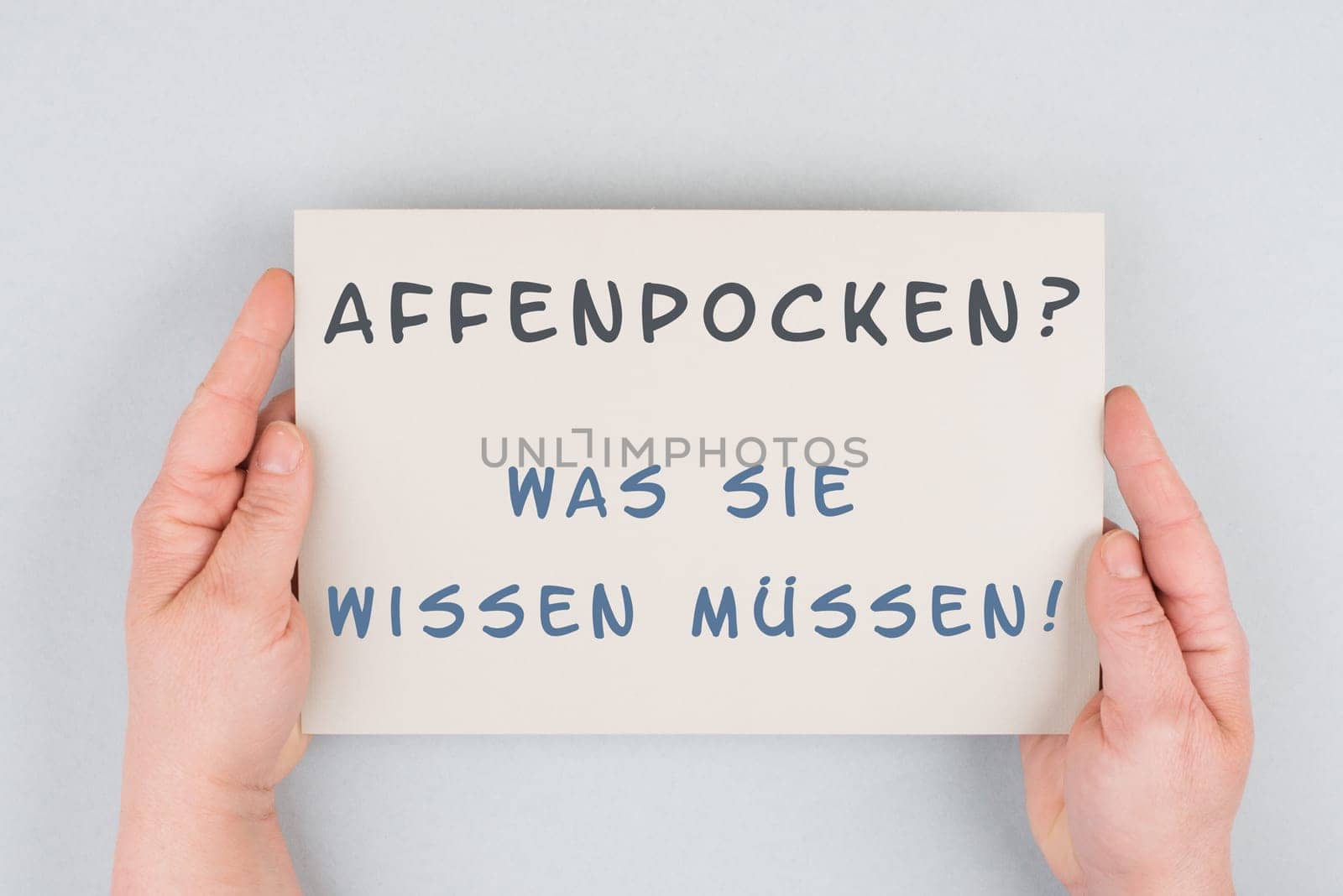 The words monkeypox, what you need to know, are standing in german language on a paper, outbreak of the MPXV virus, infectious disease spreading