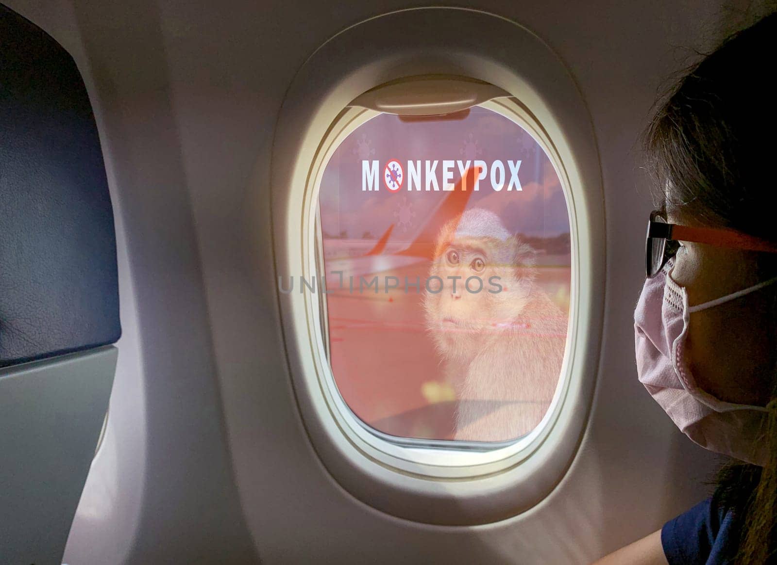 Woman wear surgical mask sit on passenger seat near cabin window of the airplane with monkeypox outbreak concept. Monkeypox is caused by monkeypox virus. Traveling by plane during monkeypox outbreak.