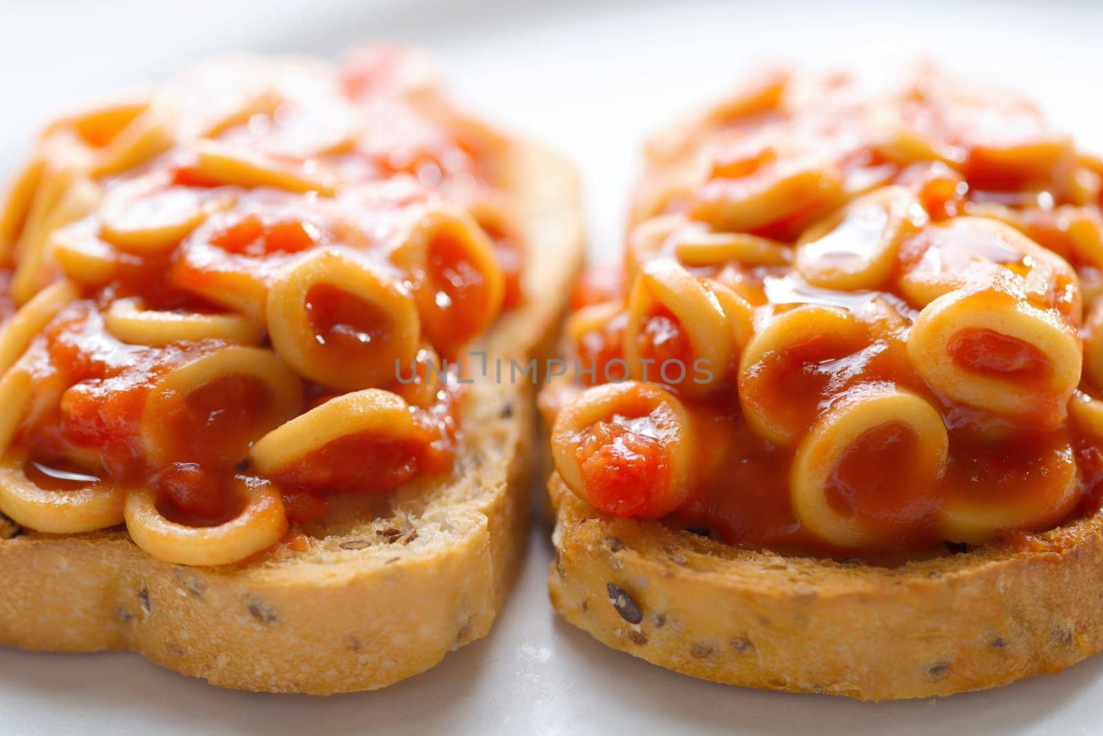 close up of english aussie pasta hoops in tomato sauce toast comfort food