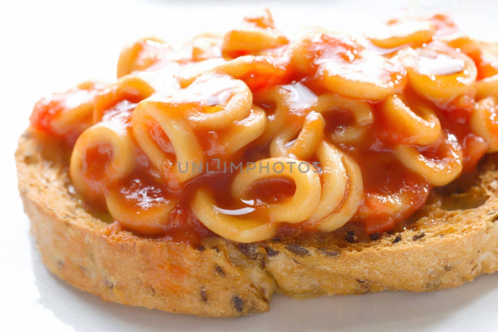 close up of english aussie pasta hoops in tomato sauce toast comfort food