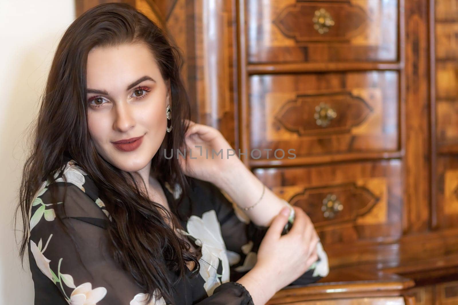 Front view portrait of smiling dark haired girl. Horizontally.