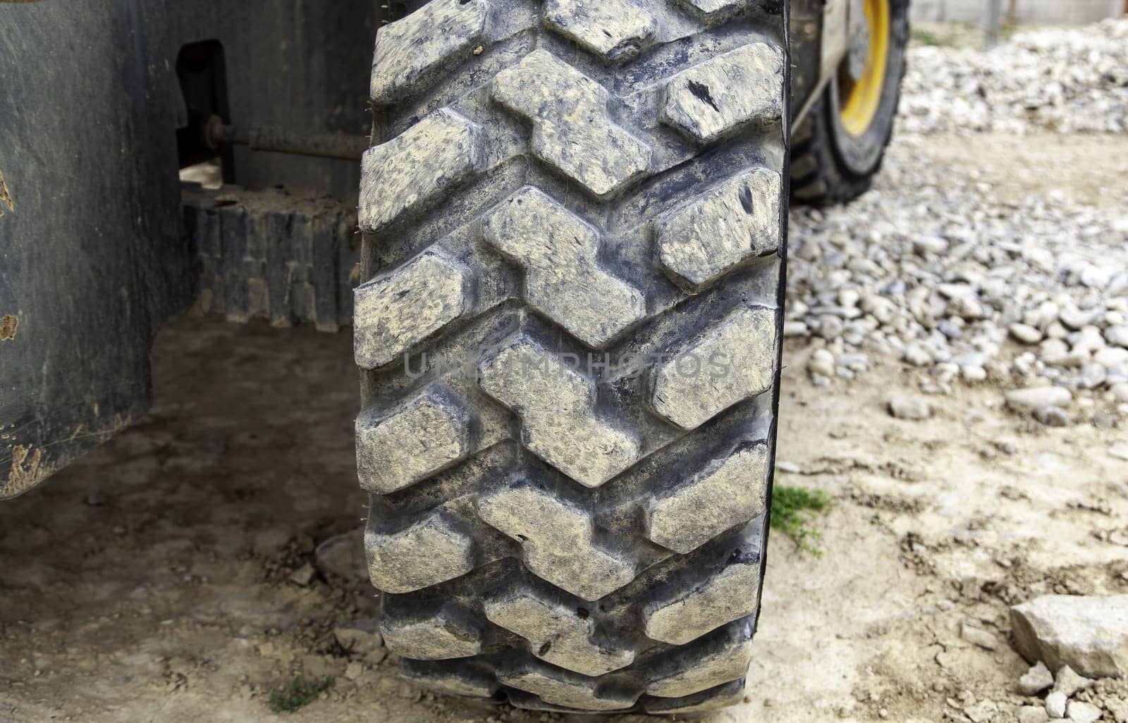 Detail of large rubber wheel of industrial vehicle