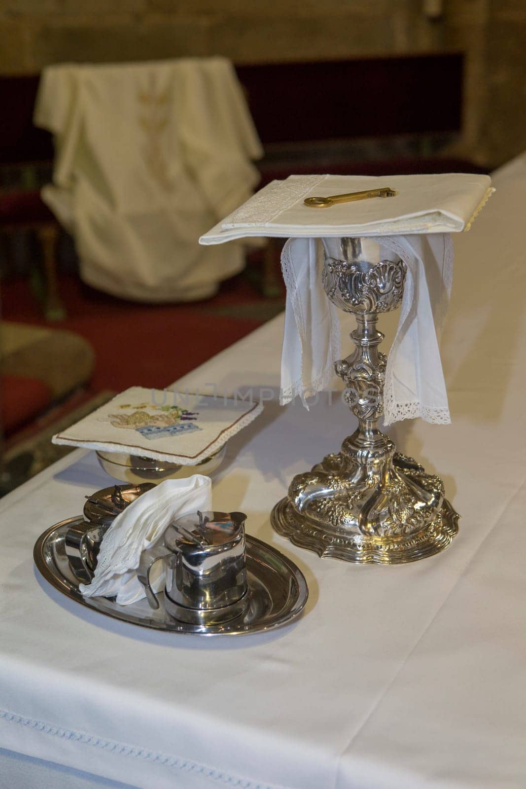 Plasencia, Spain - May 21h, 2022: Chalice, wine, water pitcher and pyx at Saint Nicholas Church, Plasencia, Caceres, Extremadura, Spain