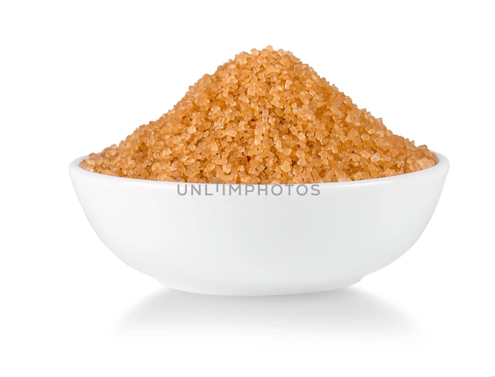 The brown sugar in bowl isolated on white background