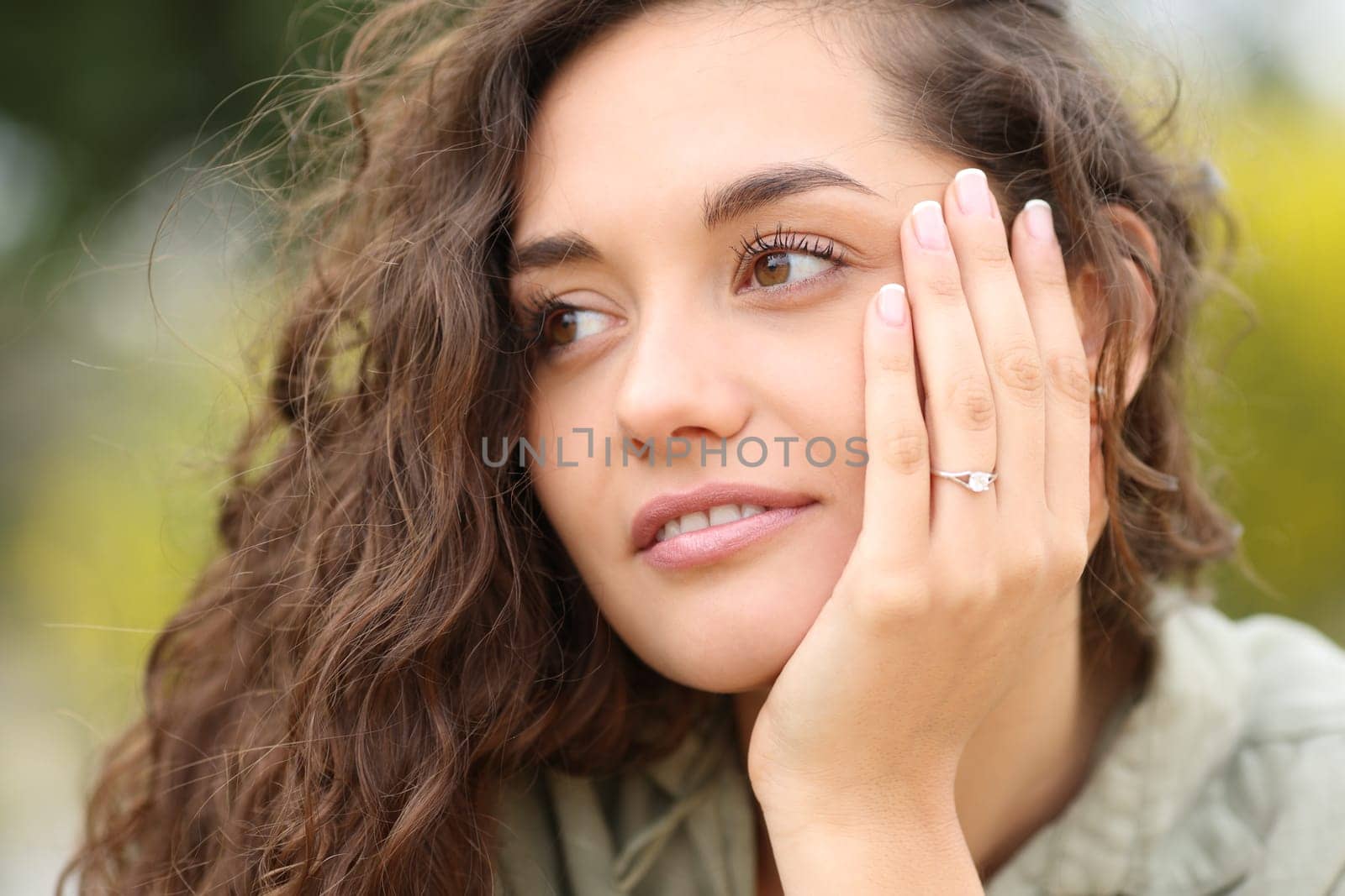 Woman showing engagement ring after proposal