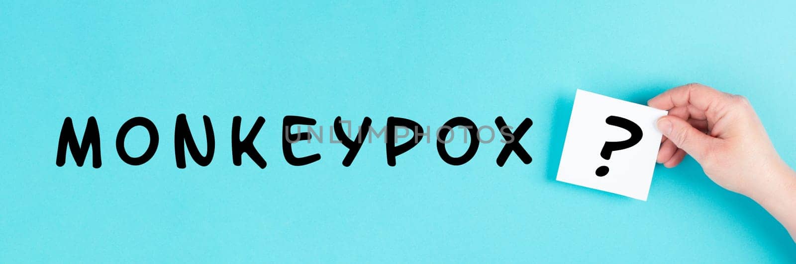 The word monkeypox is standing on a paper, outbreak of the MPXV virus, infectious disease spreading