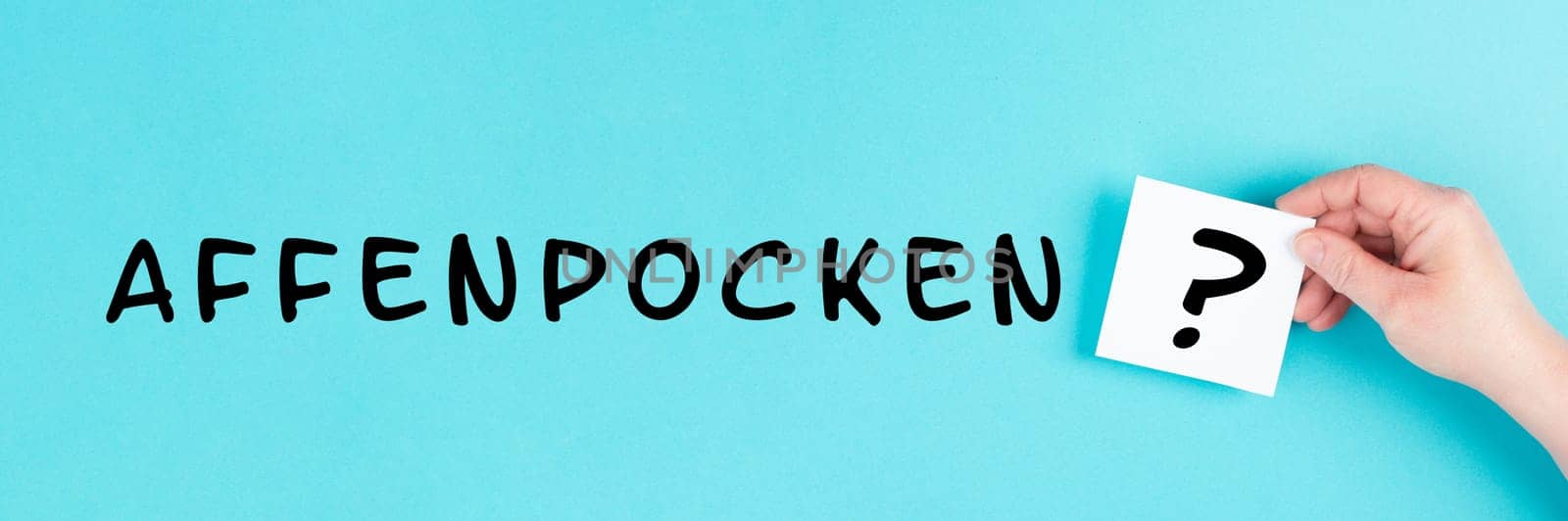 The word monkeypox is standing in german language on a paper, outbreak of the MPXV virus, infectious disease spreading