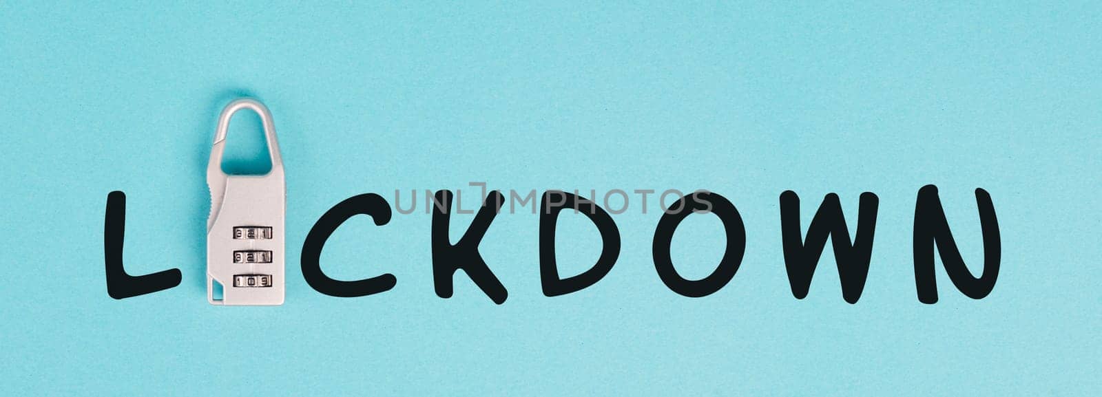 The word lockdown is standing on a blue paper, Covid-19 and monkeypox pandemic regulations, lock up people