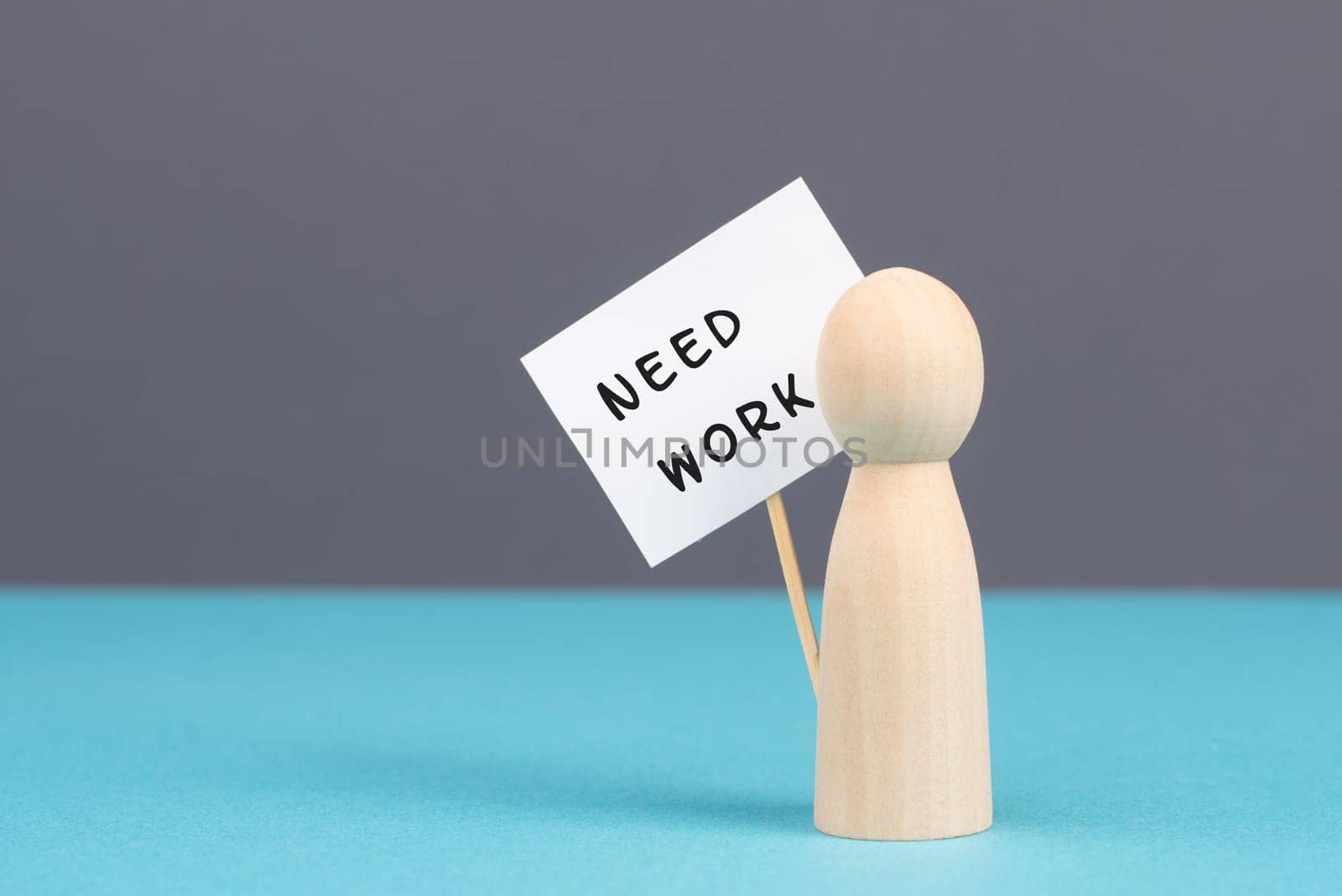 Man with a sign need work, unemployed is looking for a job, financial crisis, jobless people, social issue