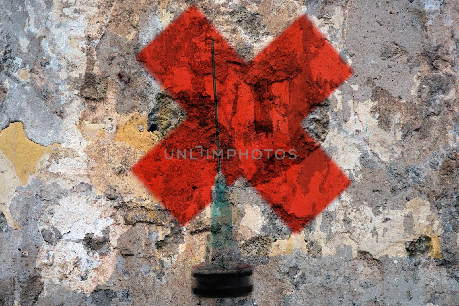 Syringe and red cross