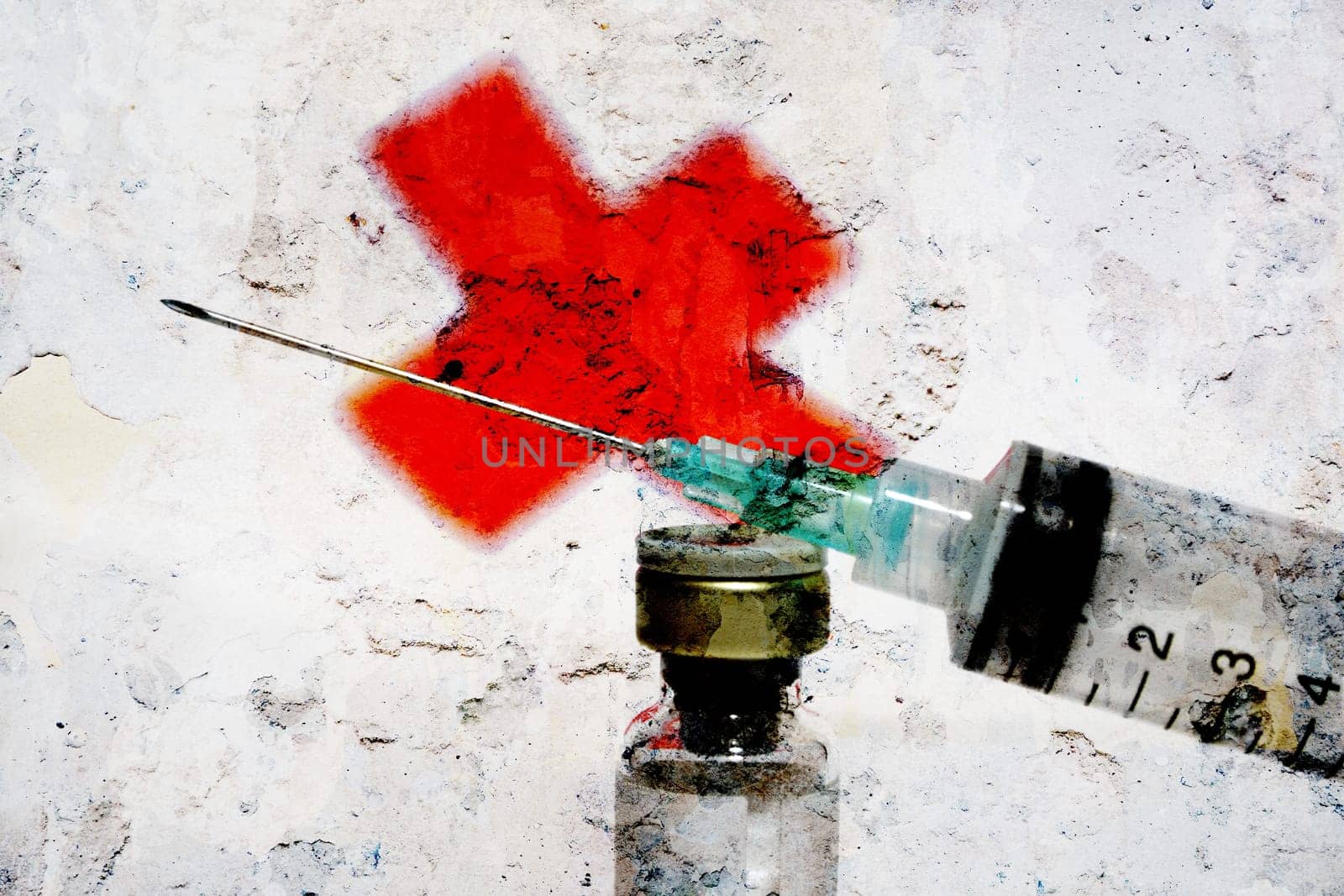 Syringe and red cross