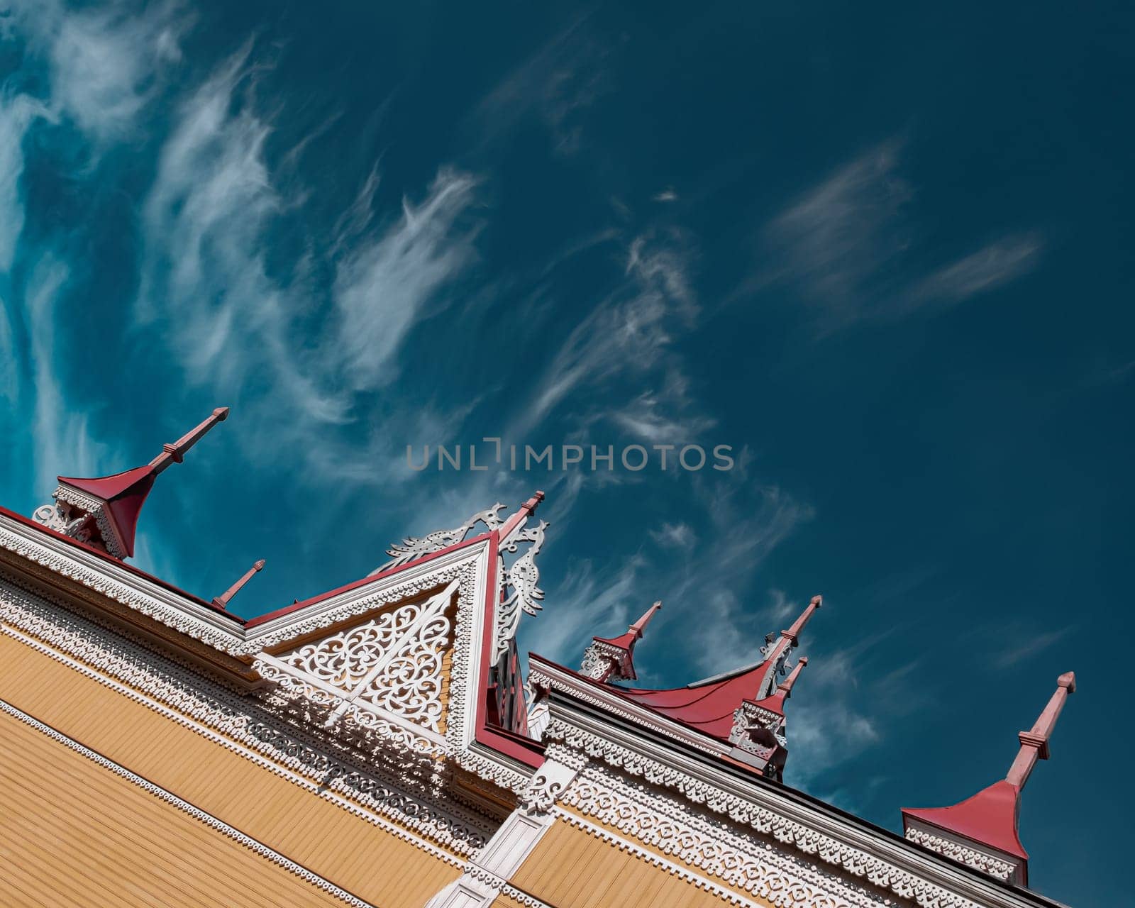 Wooden historical building in Tomsk on the sky background editorial