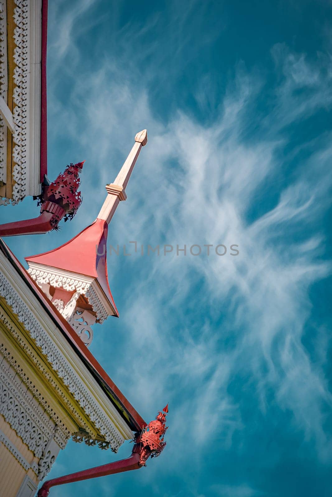 Wooden historical building in Tomsk on the sky background editorial