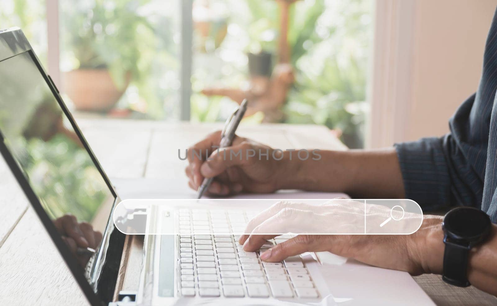 Business man searching and working with computer laptop on table at home. Working online business concept.