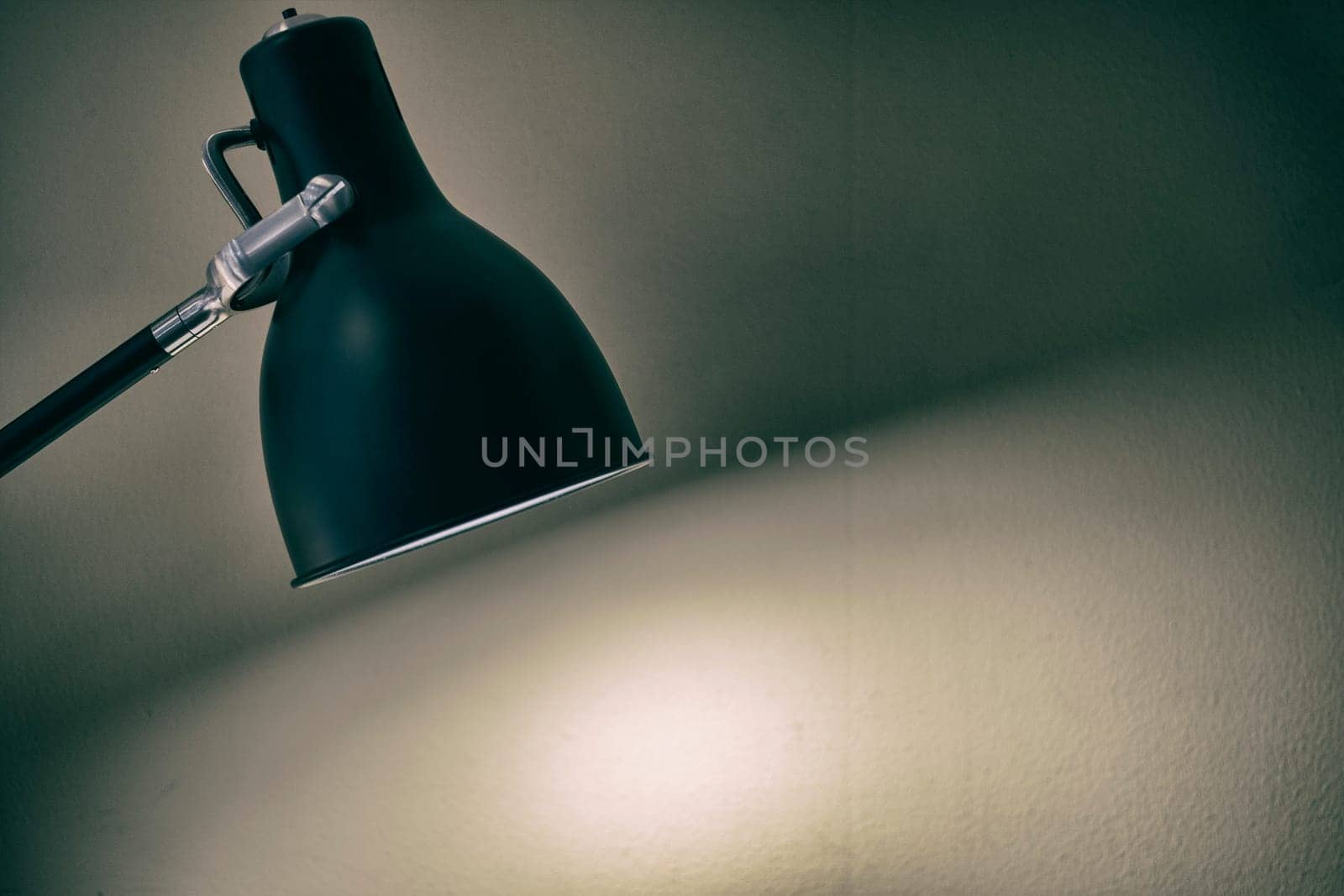 Black fixture lamp with white  wall background