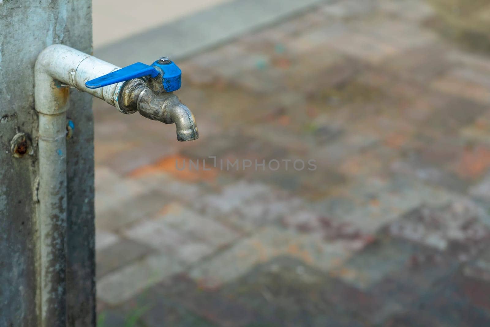 Old valve faucet of blue pipe water.