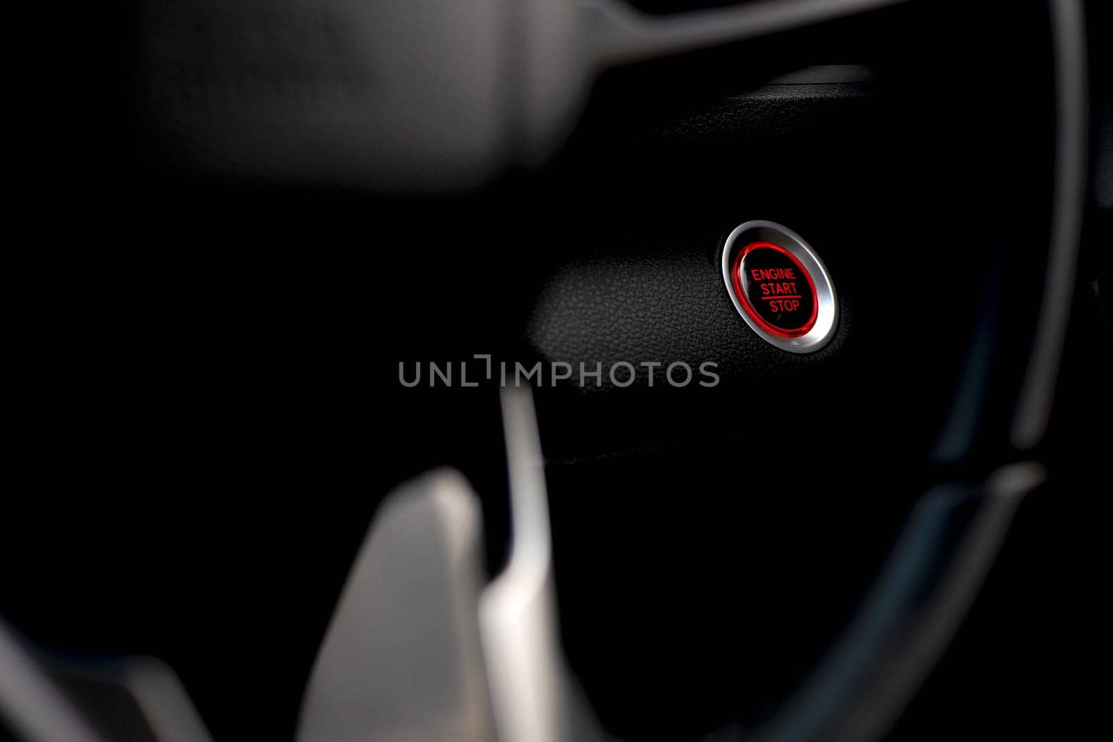 Start button in car engine red push