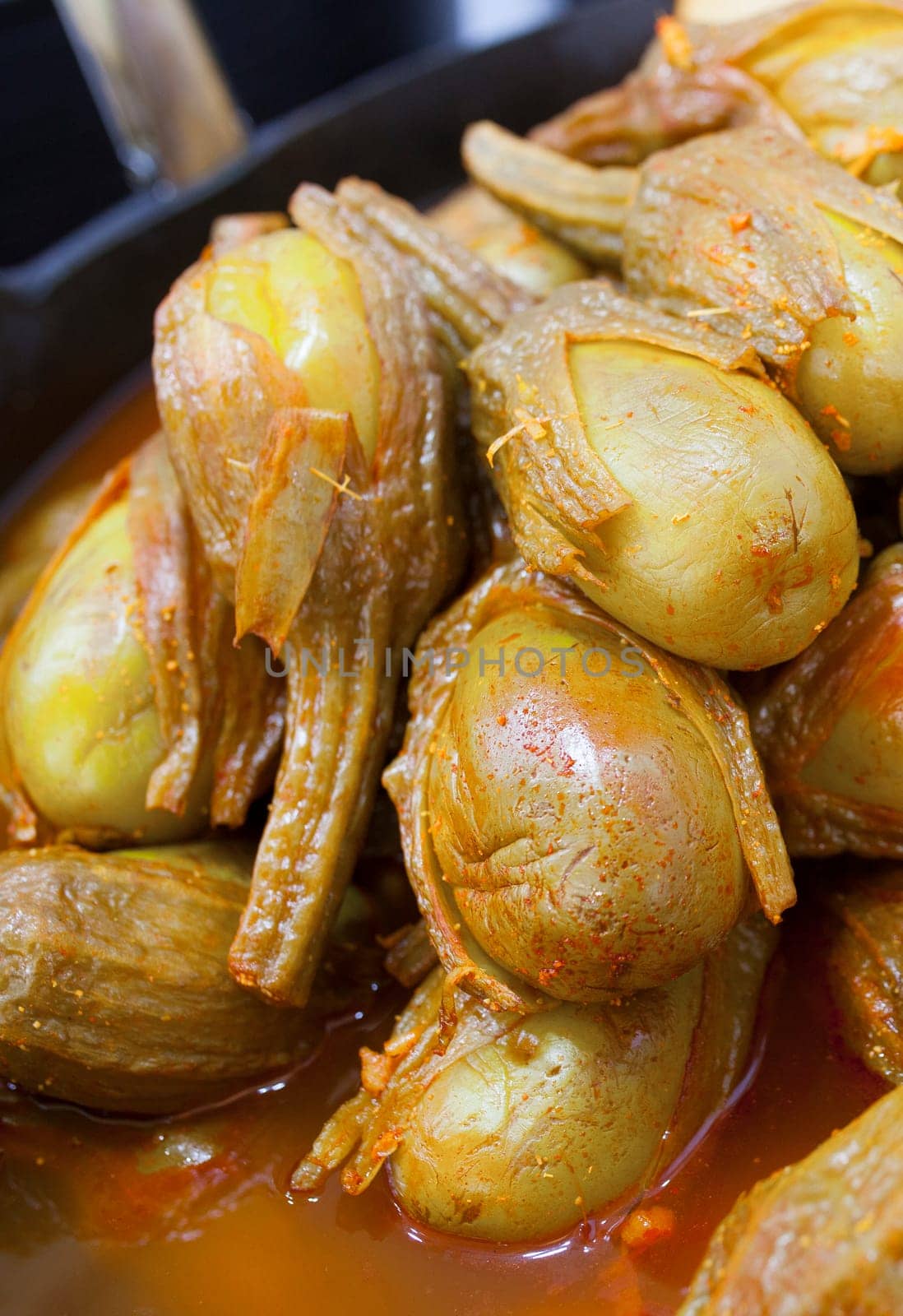 Almagro pickled eggplants. Delicious pickled snack displayed plastic basket