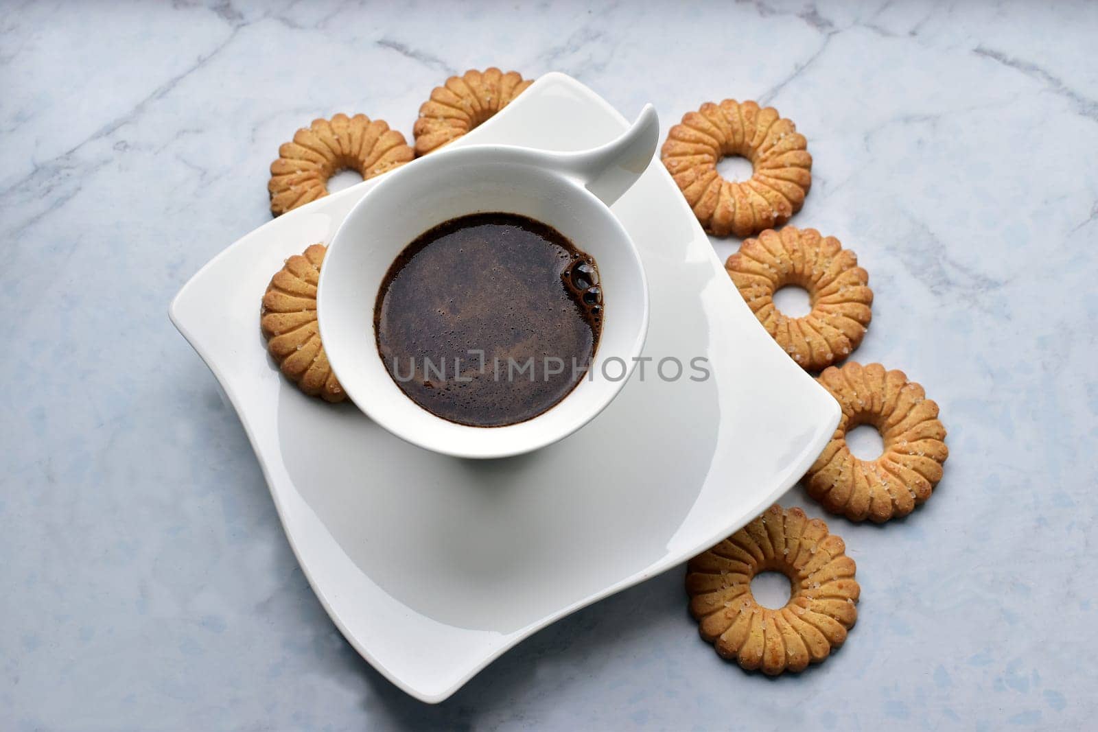black coffee in a decorative white cup