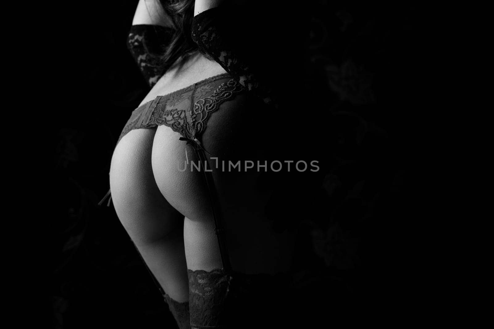 Female back in laced lingerie.