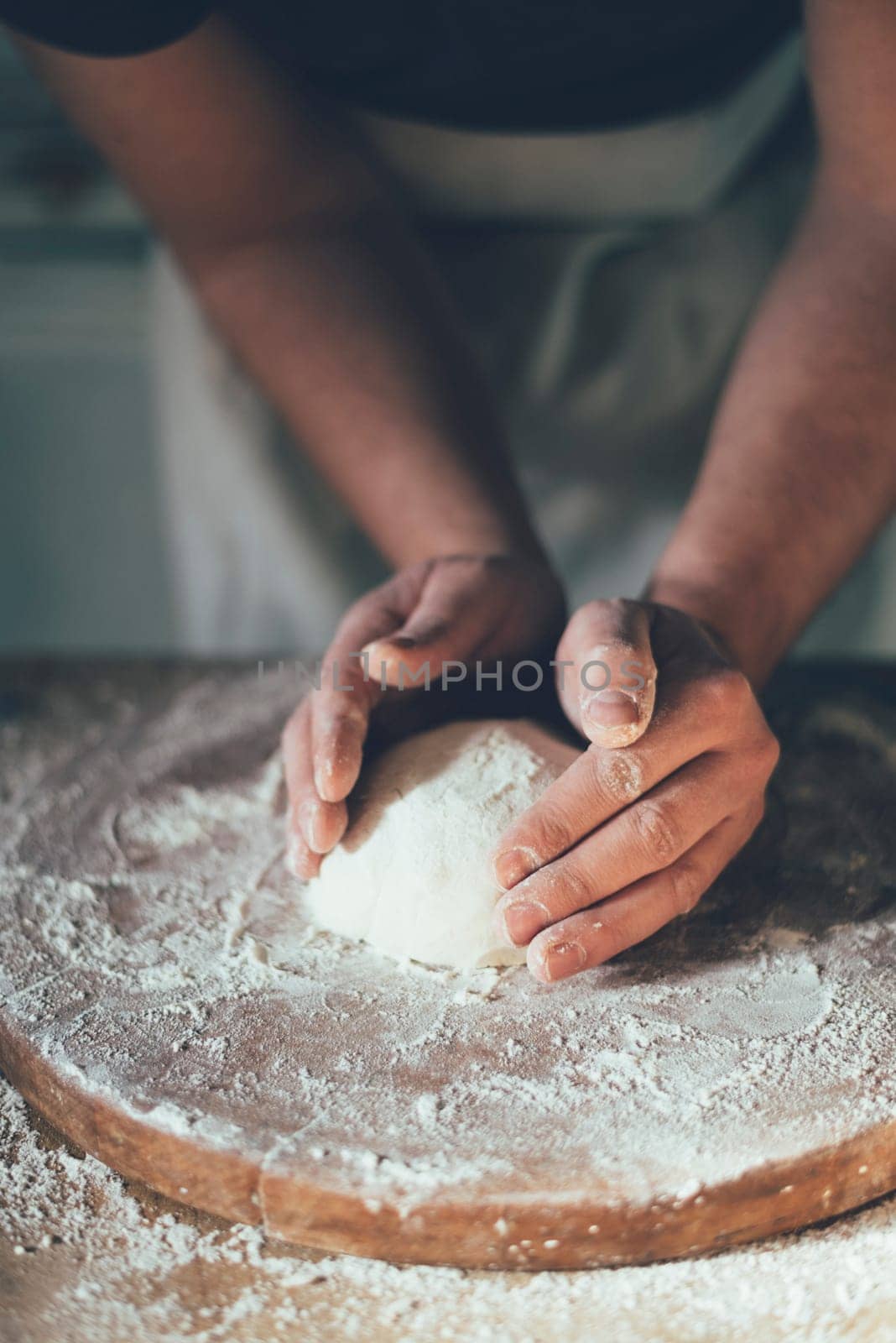 Man baking bread in the kitchen. Retro style.