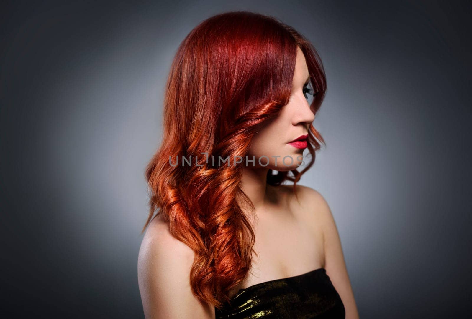 Beautiful woman with fashionable red hairstyle