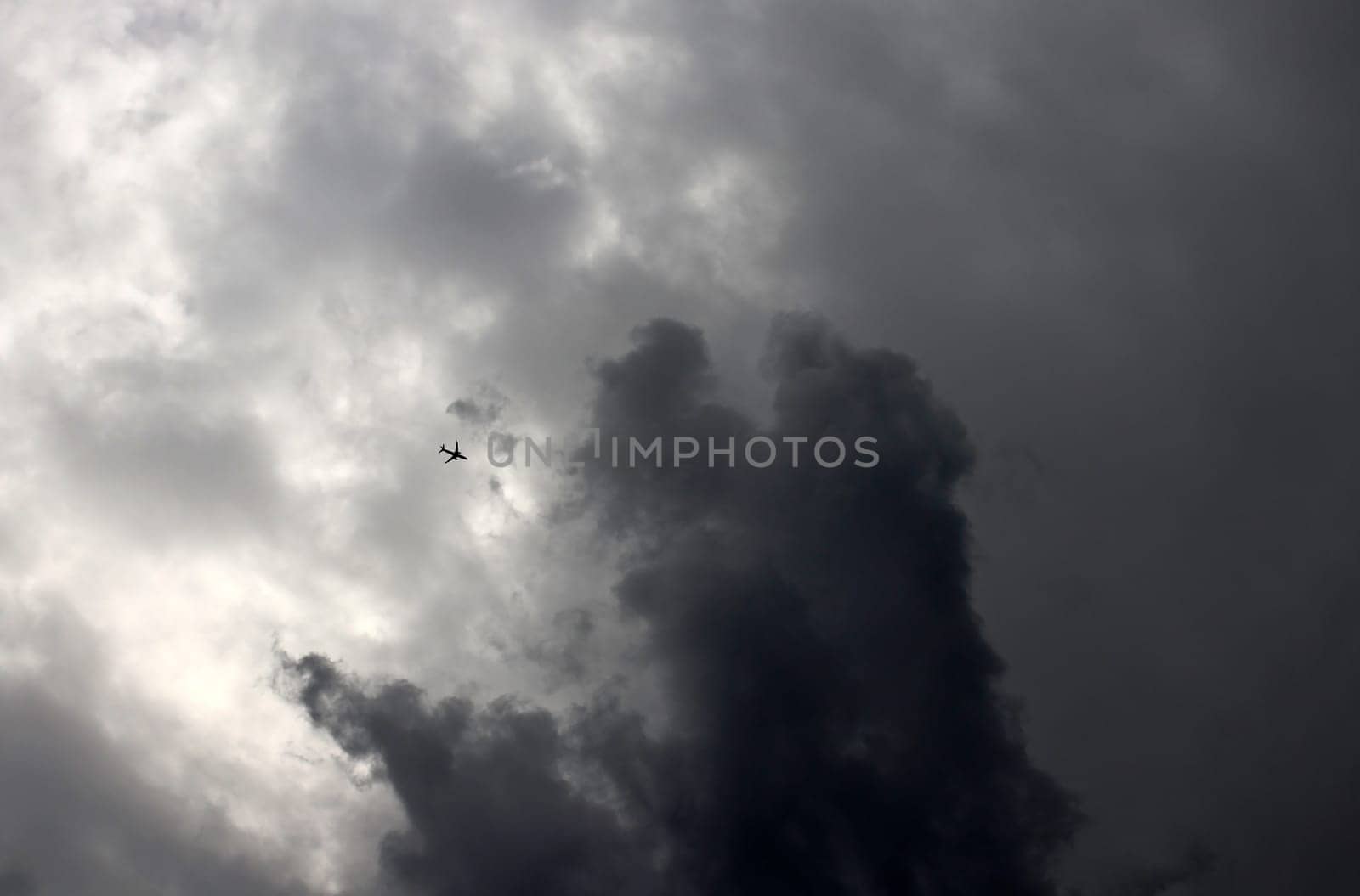 A passenger plane flies into a thundercloud