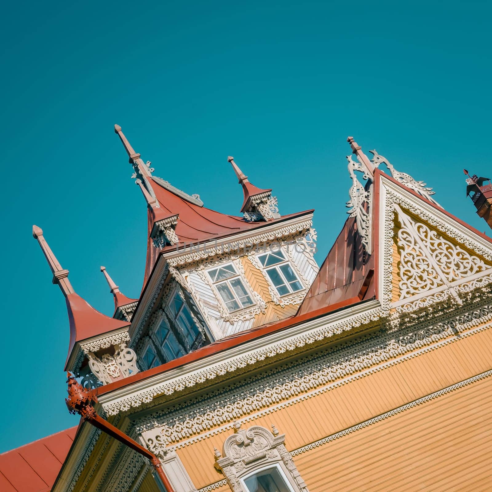 Wooden historical building in Tomsk on the sky background editorial