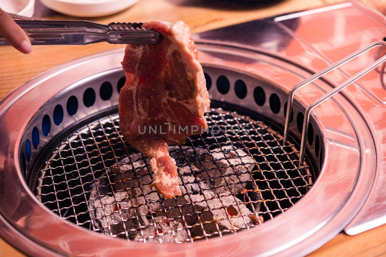 Korean beef barbecue on hot coals. Grill meat pork Korean BBQ traditional style on stove serve in restaurant, Japanese food