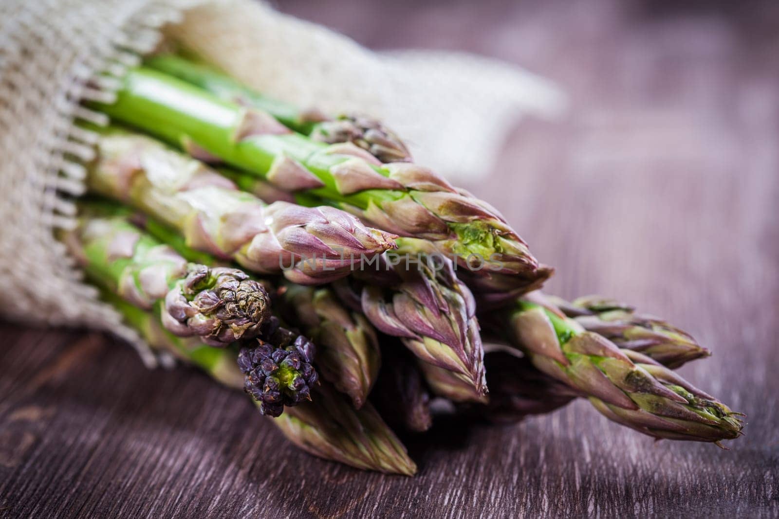 Fresh green asparagus on wooden table