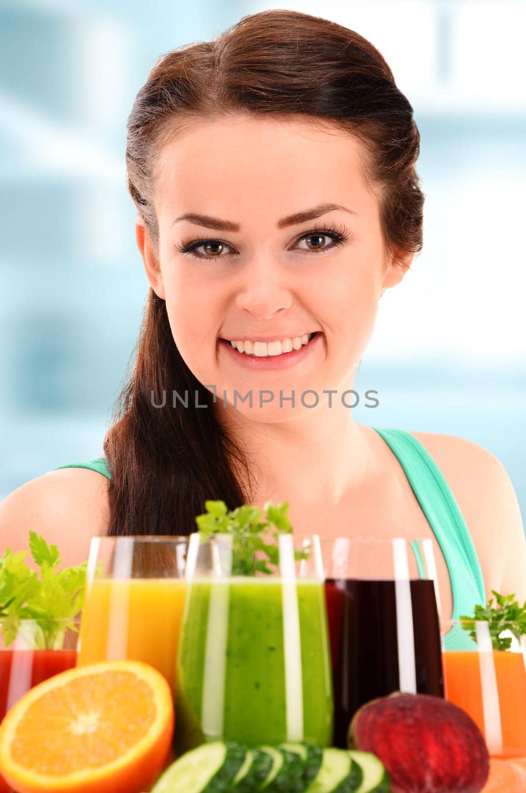Young woman with variety of vegetable and fruit juices. Detox diet.
