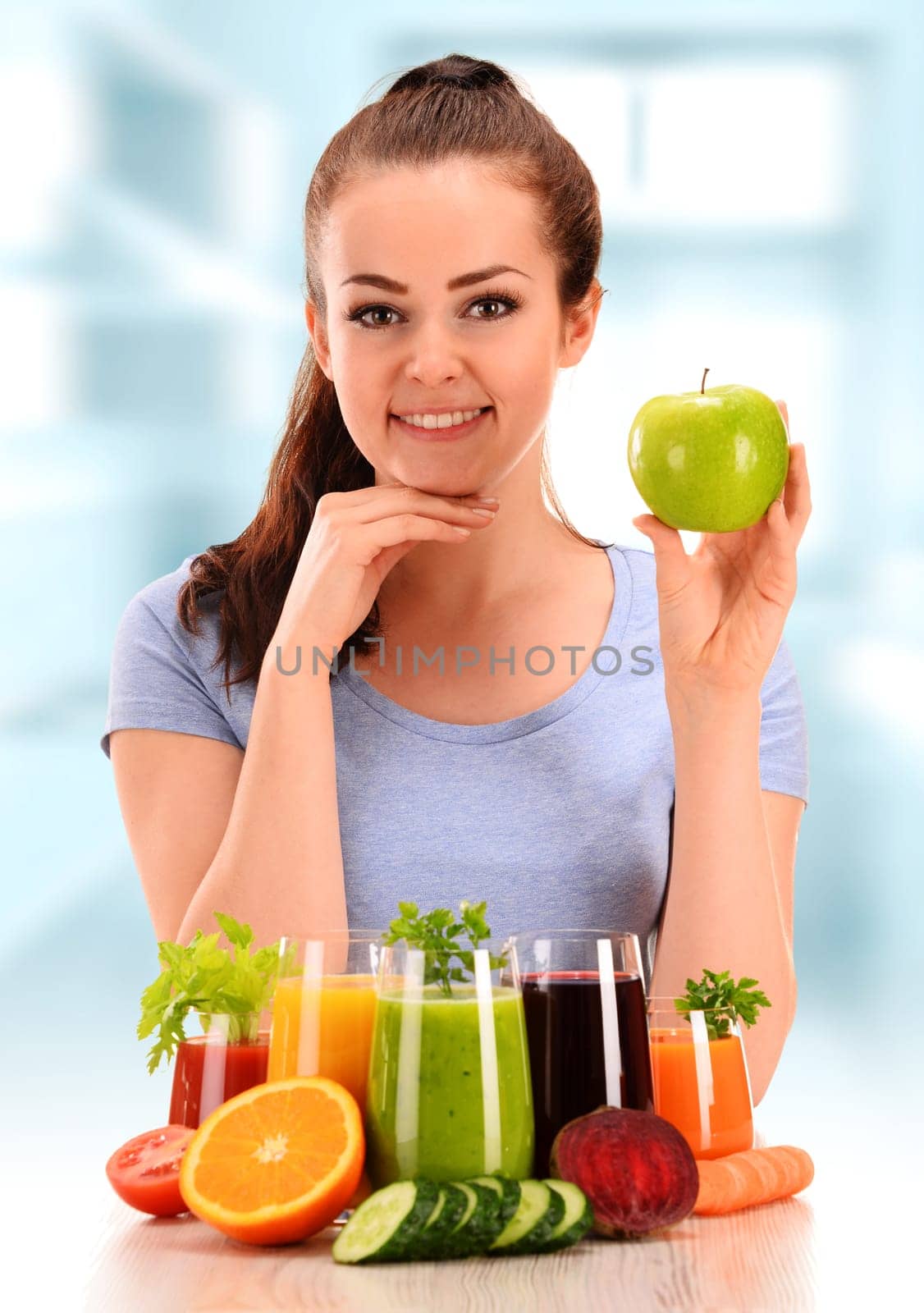 Young woman with variety of vegetable and fruit juices. Detox diet.