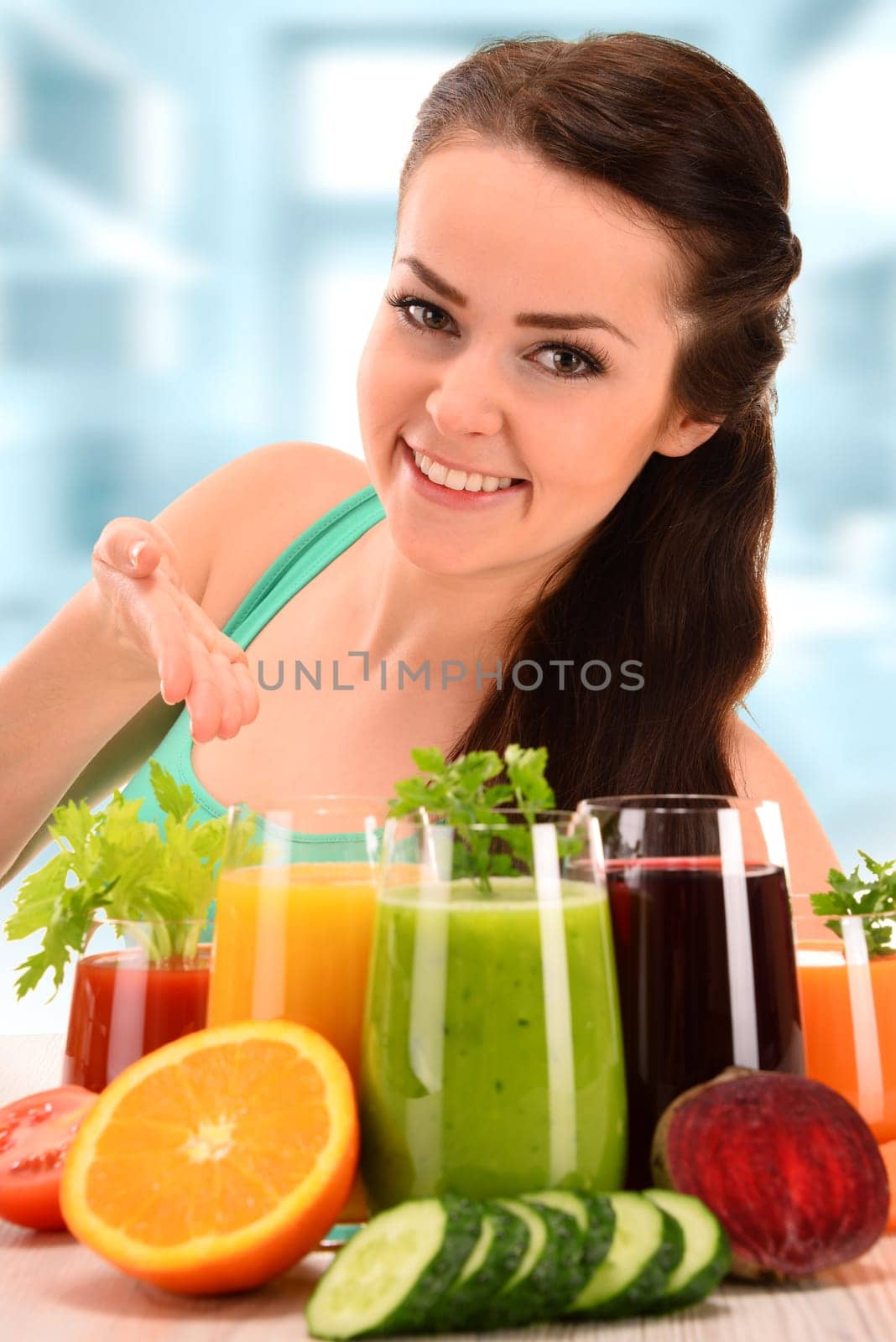 Young woman with variety of vegetable and fruit juices. Detox diet.