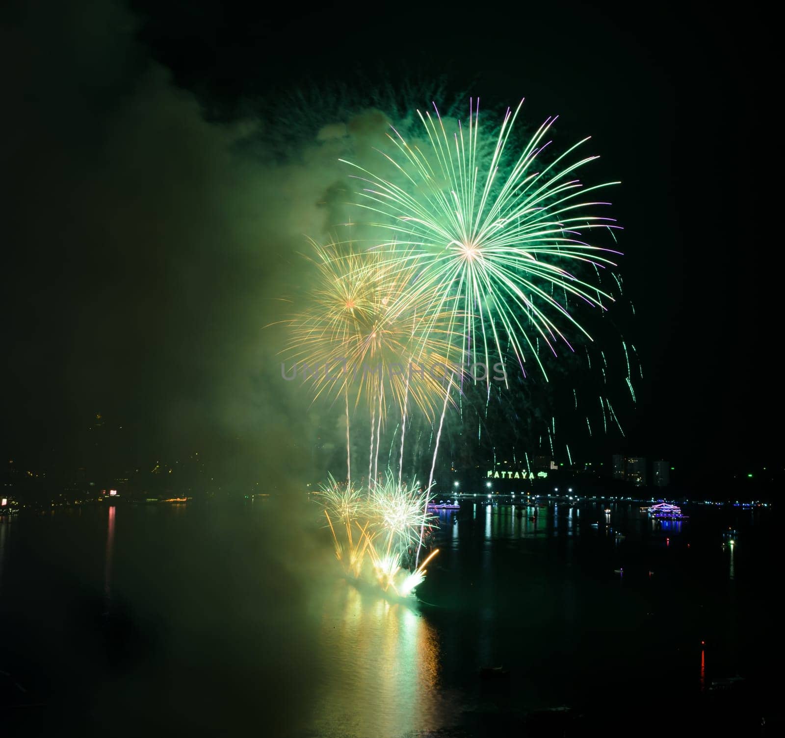 Aerial view of Pattaya city with firework at beach, Thailand