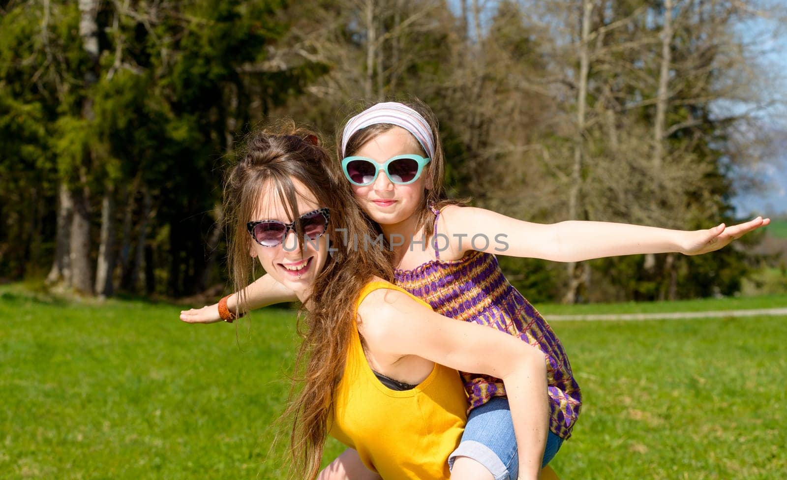 Mom and daughter play in nature
