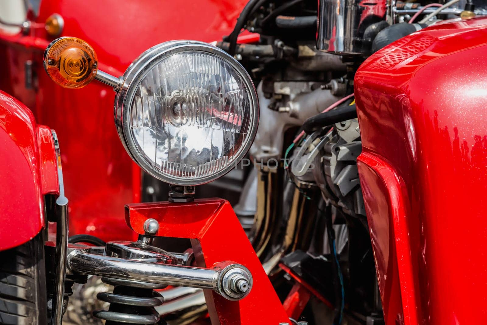 Old retro or vintage car or automobile front side with front light or headlight