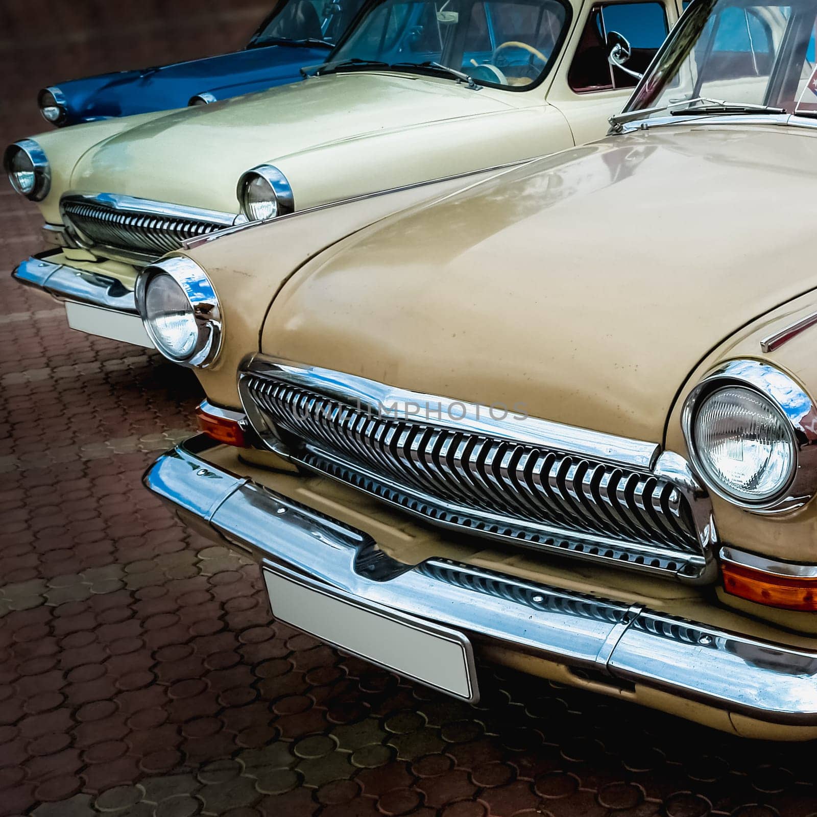 Old retro or vintage car or automobile front side with front lights or headlights and radiator grill