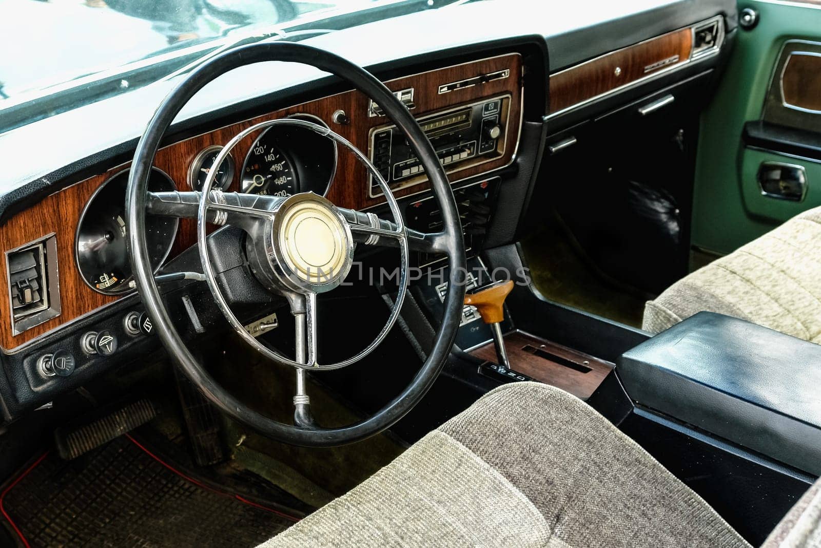 Interior of old retro vintage automobile or car with steering wheel and dashboard