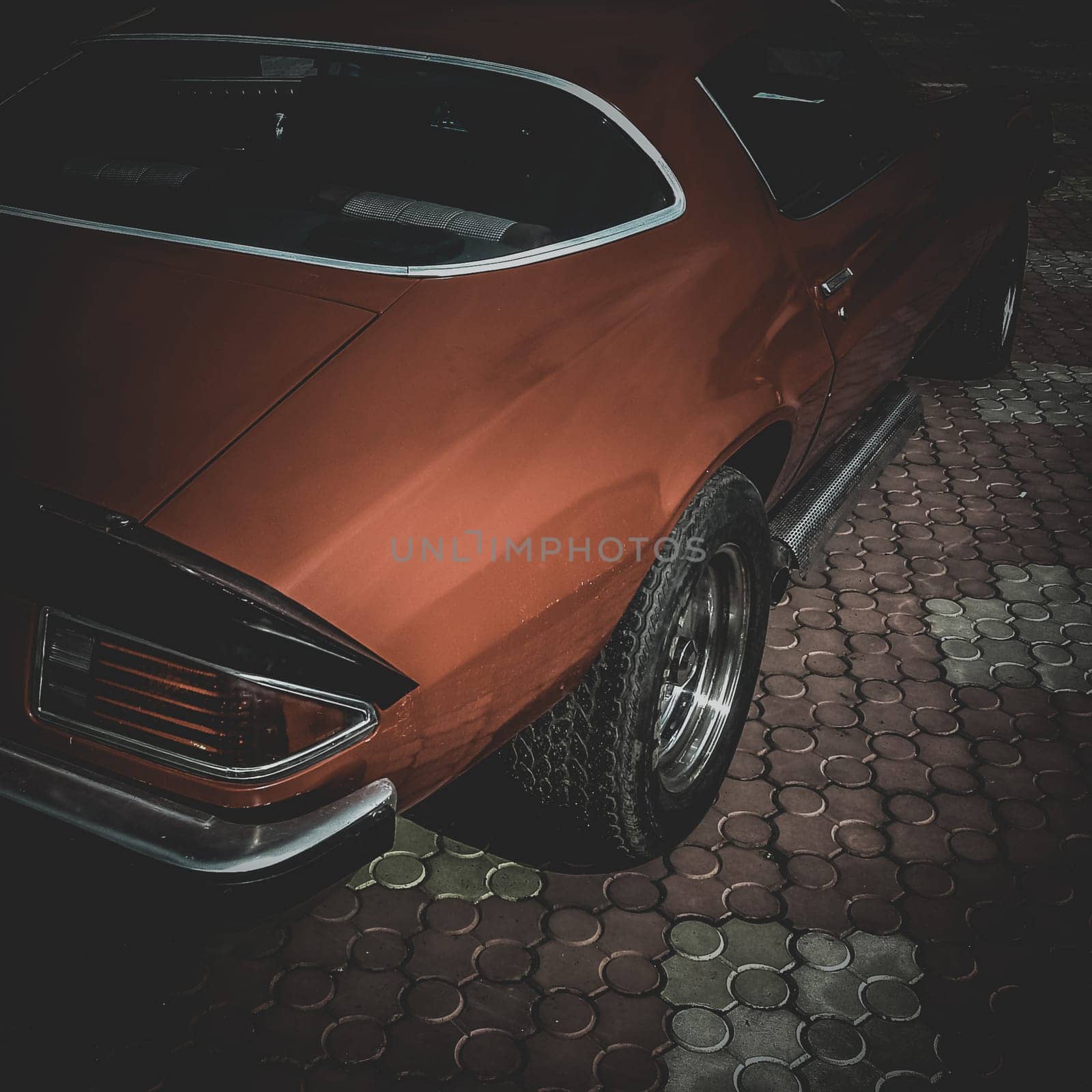 Old retro or vintage car or automobile back side with back light or taillight. Processed by vintage or retro effect filter