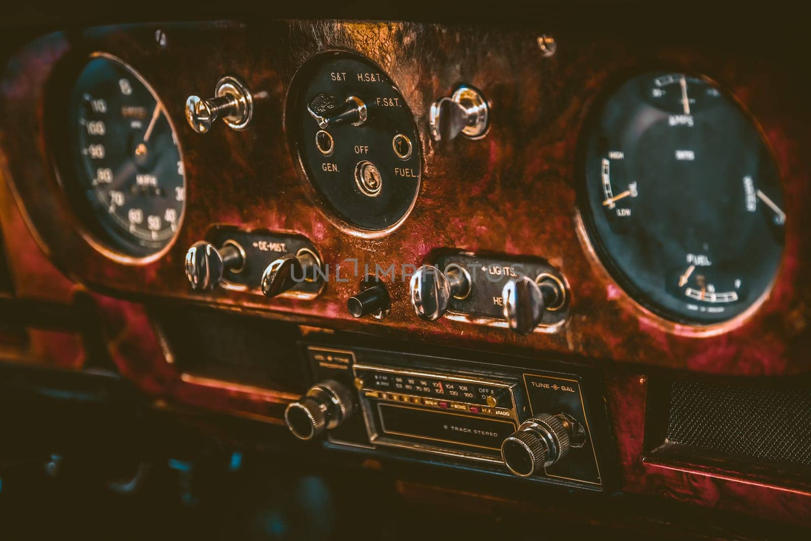 Radio in dashboard in interior of old vintage automobile. Processed by vintage or retro effect filter