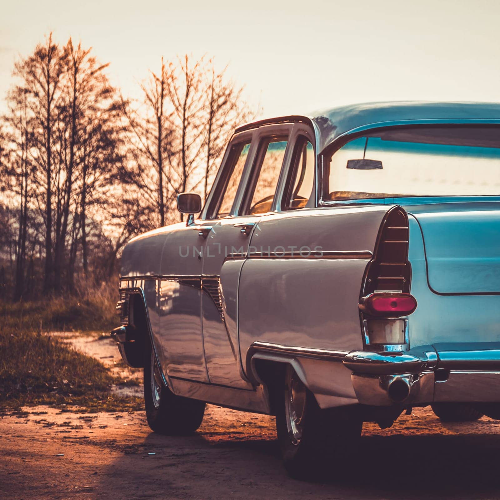 Old retro or vintage car or automobile back side with back light or taillight. Processed by vintage or retro effect filter
